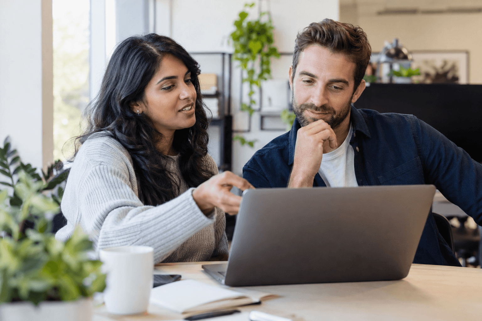 Technology colleagues reviewing customer support work